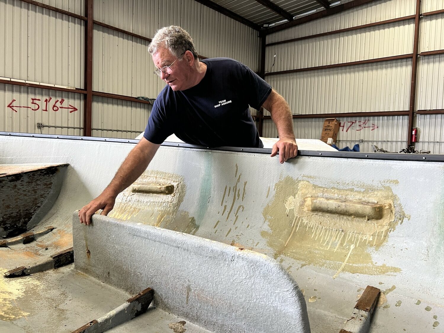 Rick Pickering, the owner of Ship Ashore Marina, working on the HarborFest whaleboats earlier this year. Gavin Menu photo