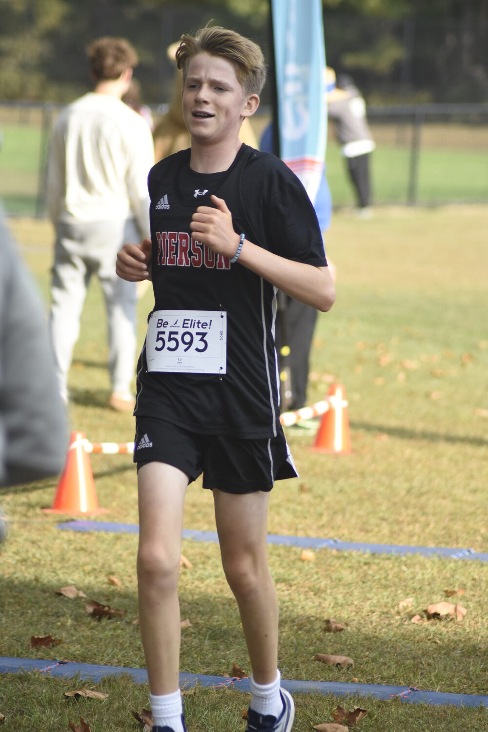 Pierson's Lincoln Fischer crosses the finish line in the freshman race.   DREW BUDD