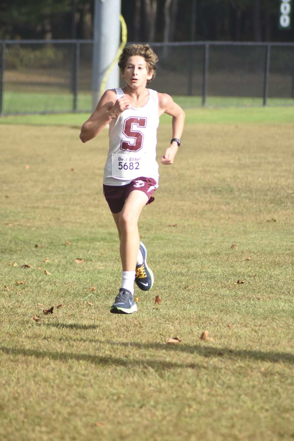 Southampton's Sam Telvi crosses the finish line in the boys freshman race.   DREW BUDD