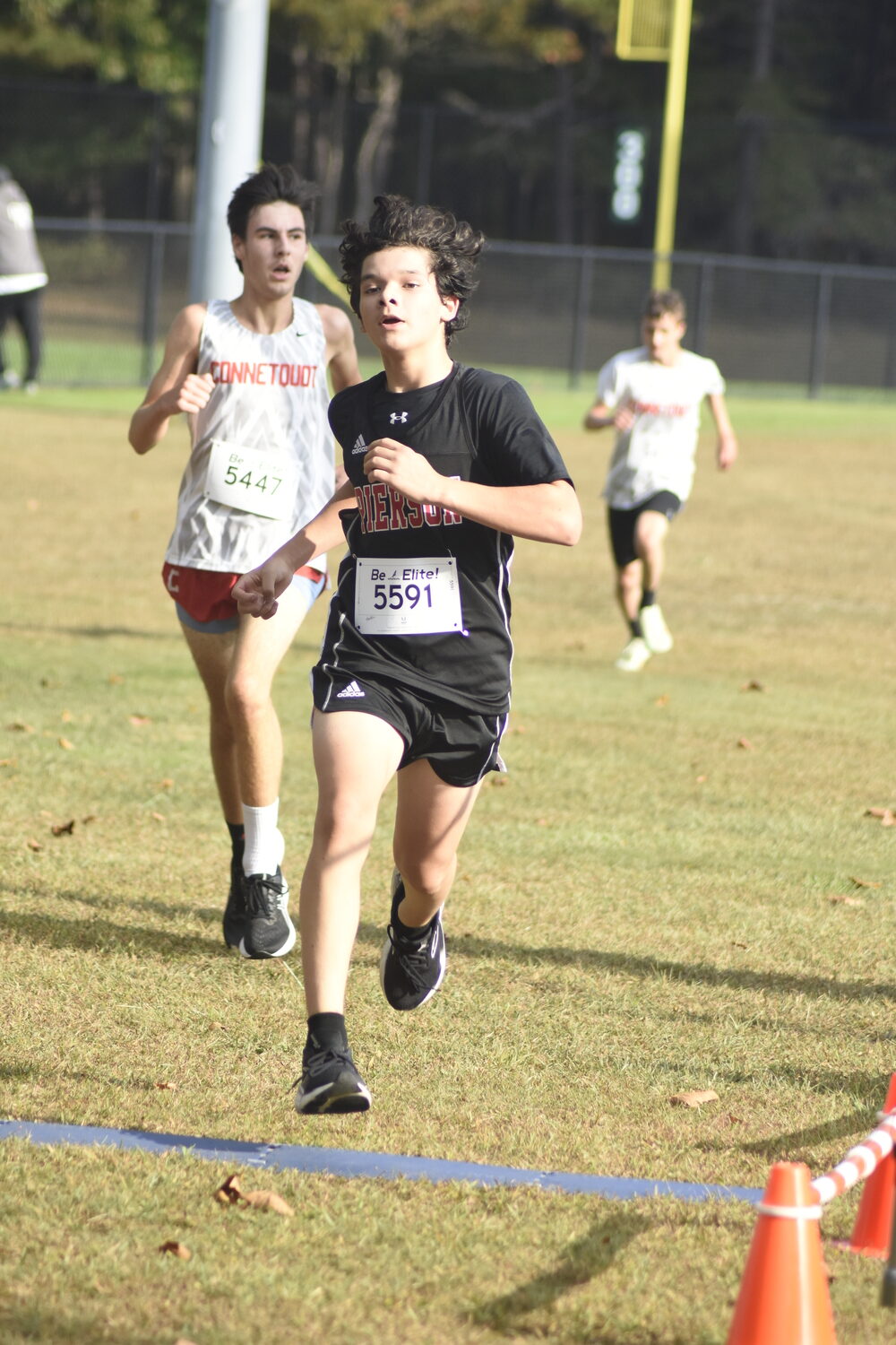 Pierson's Jackson Araya-Duran crosses the finish line in the freshman race.   DREW BUDD