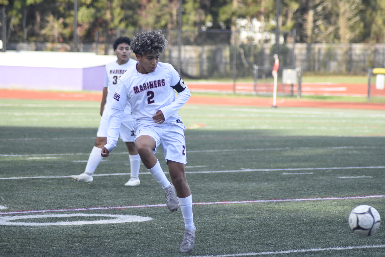 Southampton senior Rolando Bonilla Reyes boots the ball back upfield. DREW BUDD