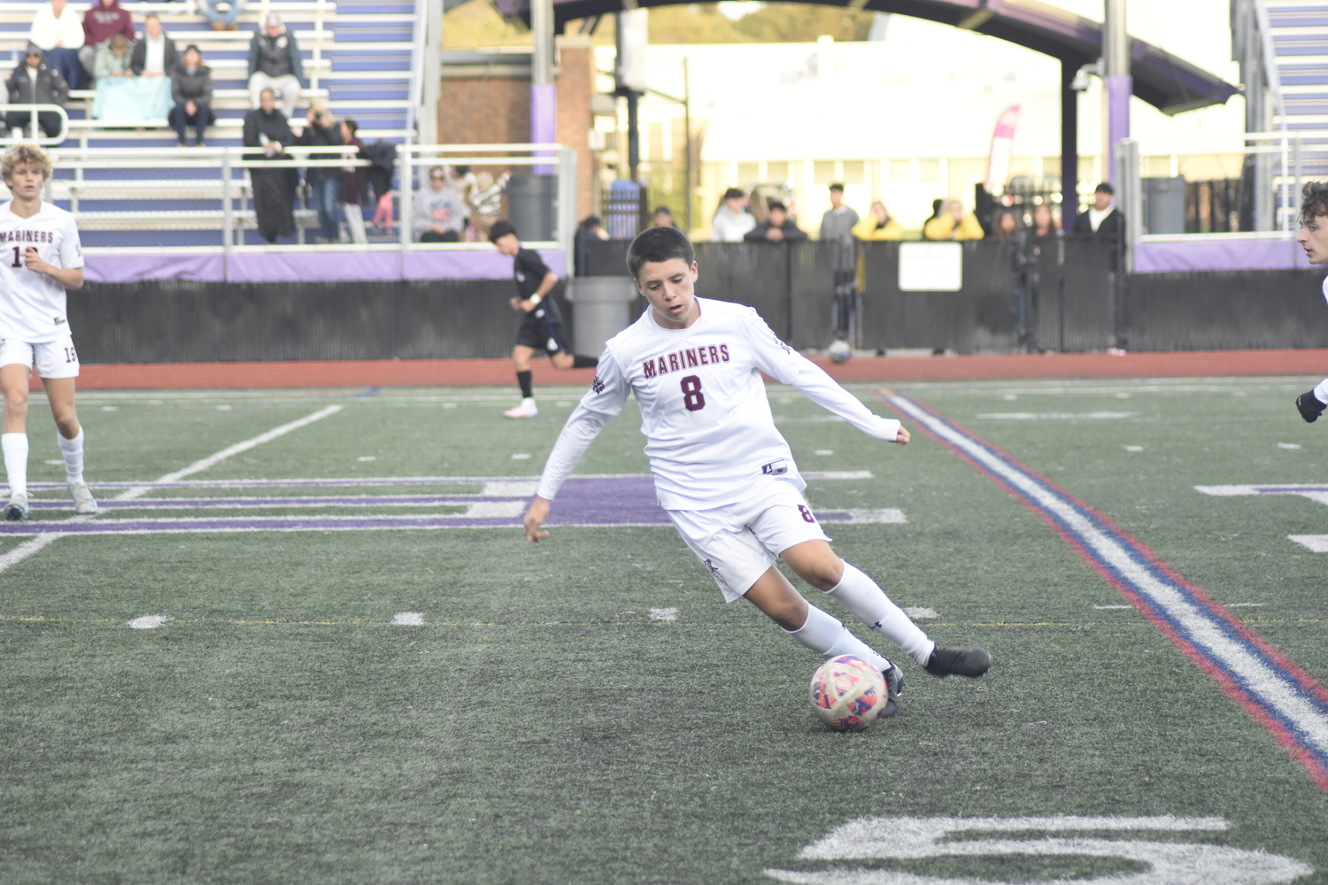 Southampton sophomore James Garvin gets the ball at midfield.   DREW BUDD