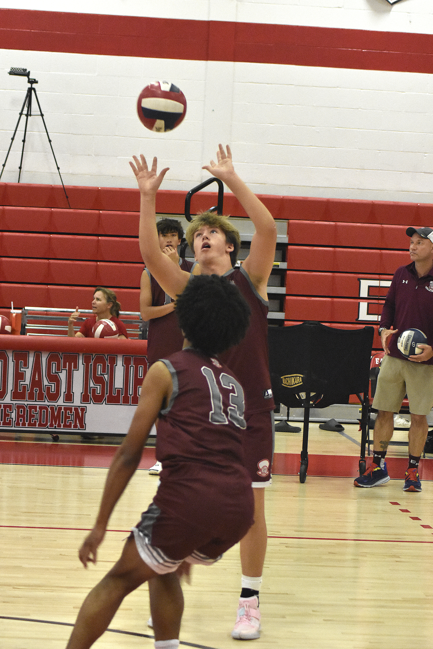 East Hampton sophomore Wyatt Zeledon sets the ball.   DREW BUDD