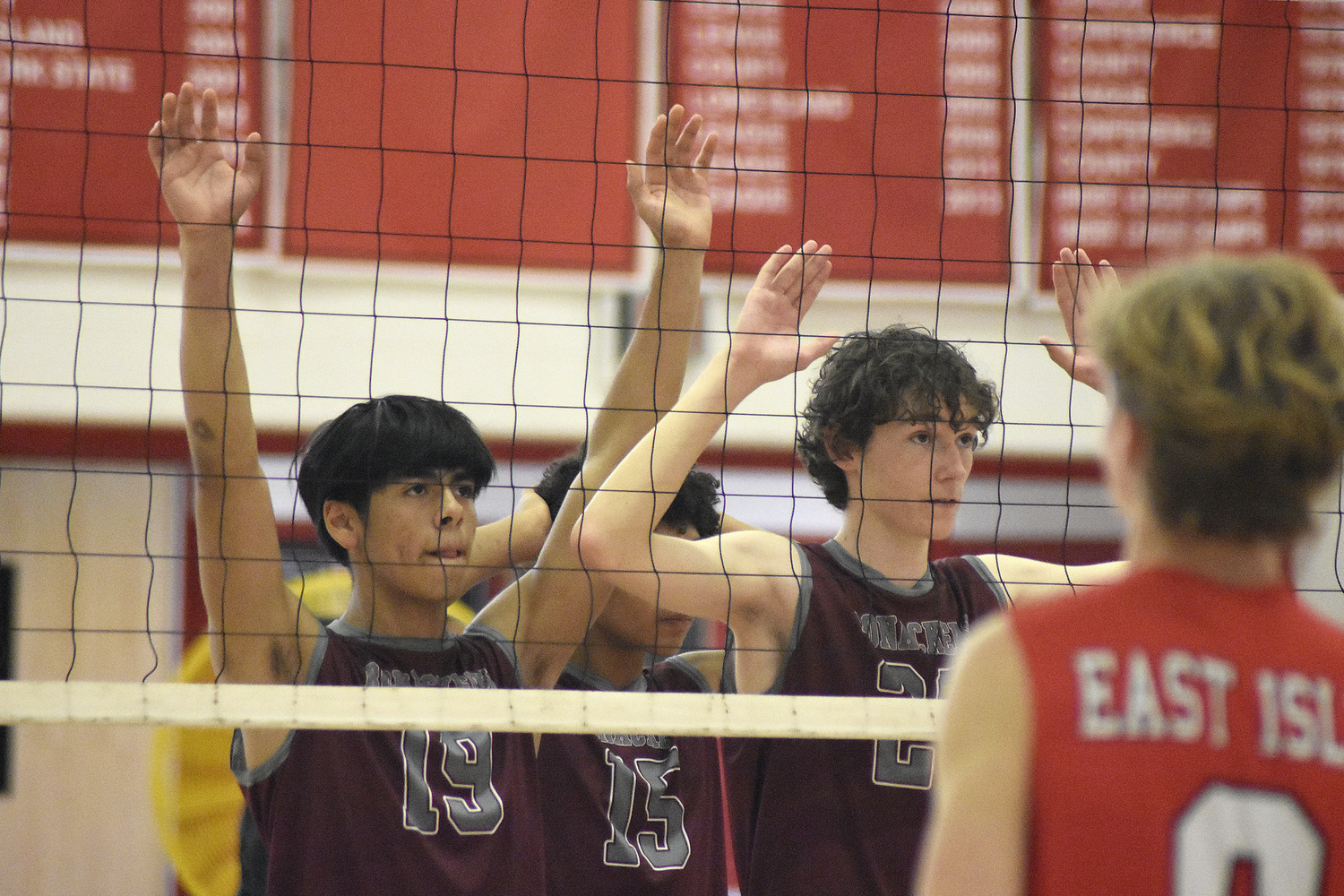 East Hampton sophomores Aaron Torres, left, and Patrick Conlon at the net.   DREW BUDD