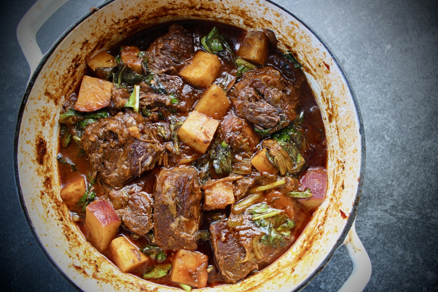 A slow cooked meal of braised short ribs with root vegetables and hearty greens. ROBYN HENDERSON-DIEDERIKS