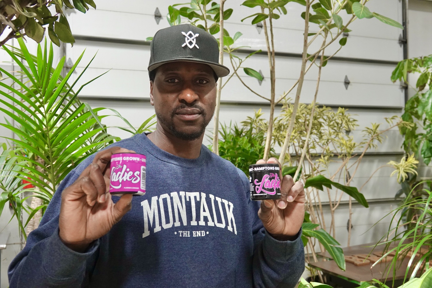 Brown Buddha New York co-owner Marq Hayes with a Bridgehampton-grown marijuana known as 