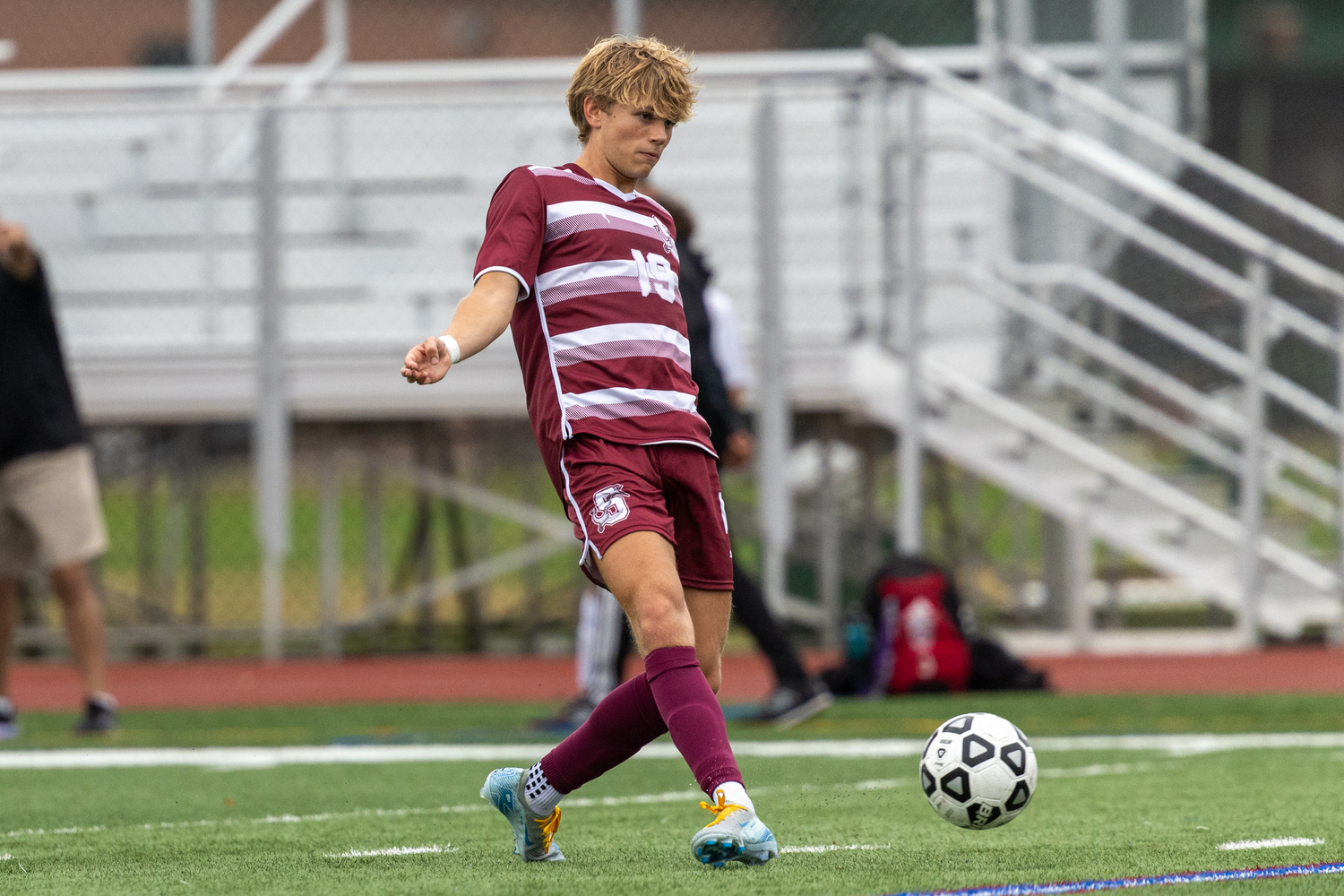 Christian Duggal playing for the boys soccer team this season.    RON ESPOSITO