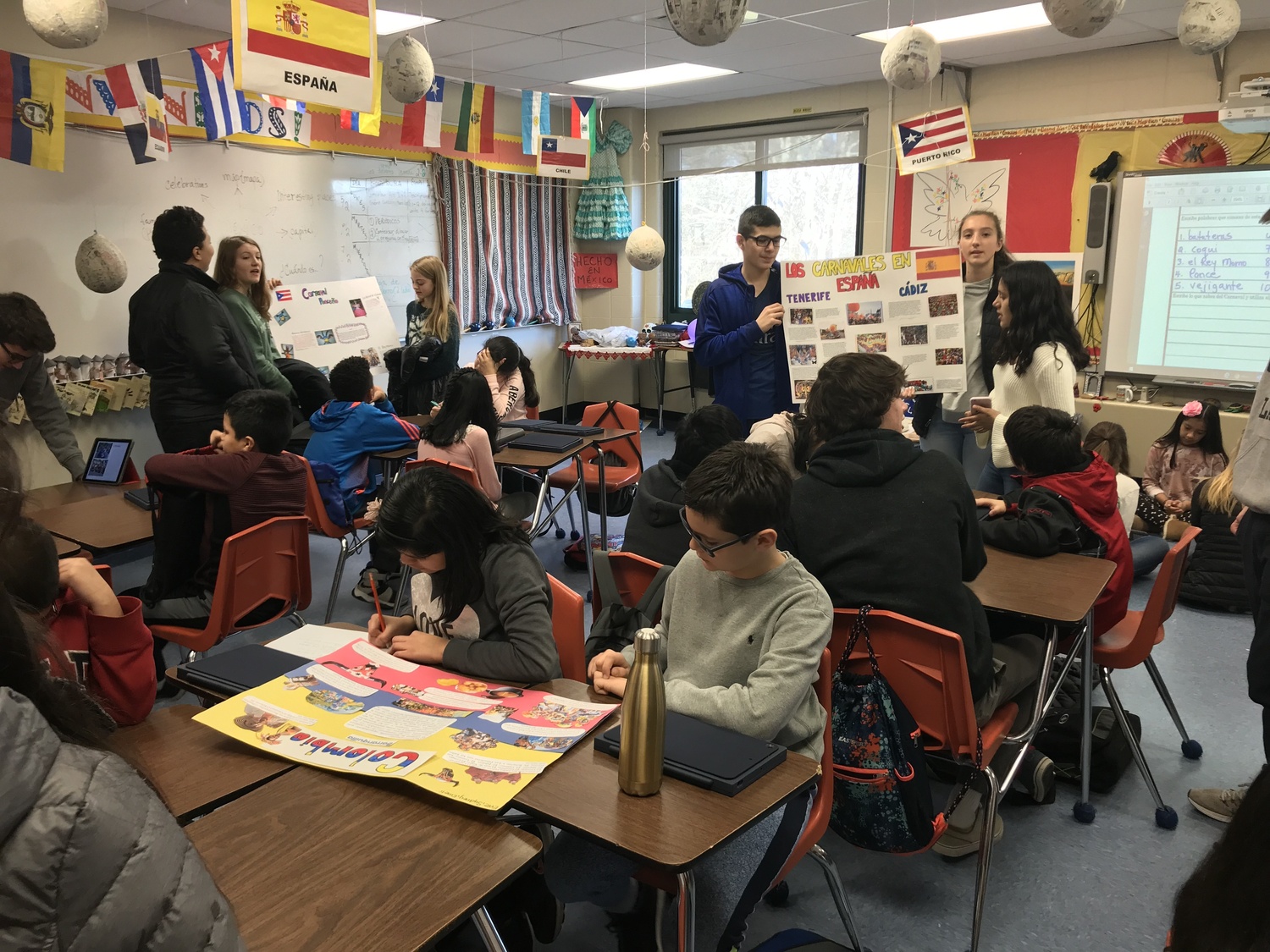 A group of Southampton High School ISA students share with their fifth grade “bilingual buddies.