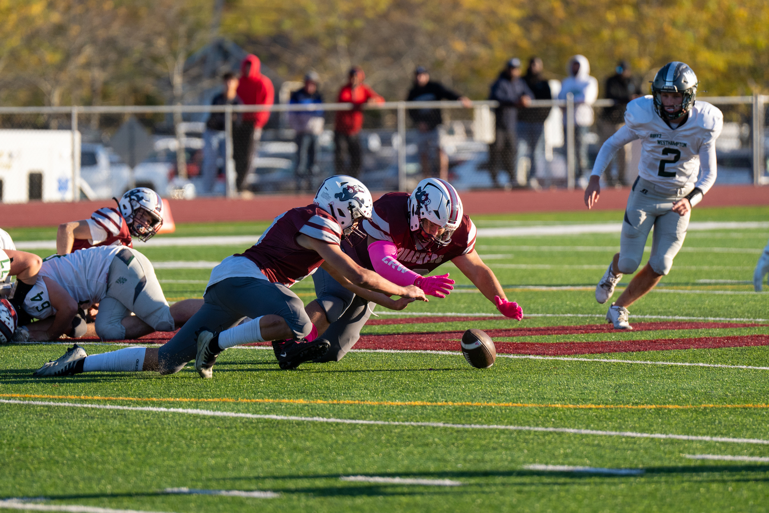 A pair of Bonackers pounce on a loose ball.   RON ESPOSITO