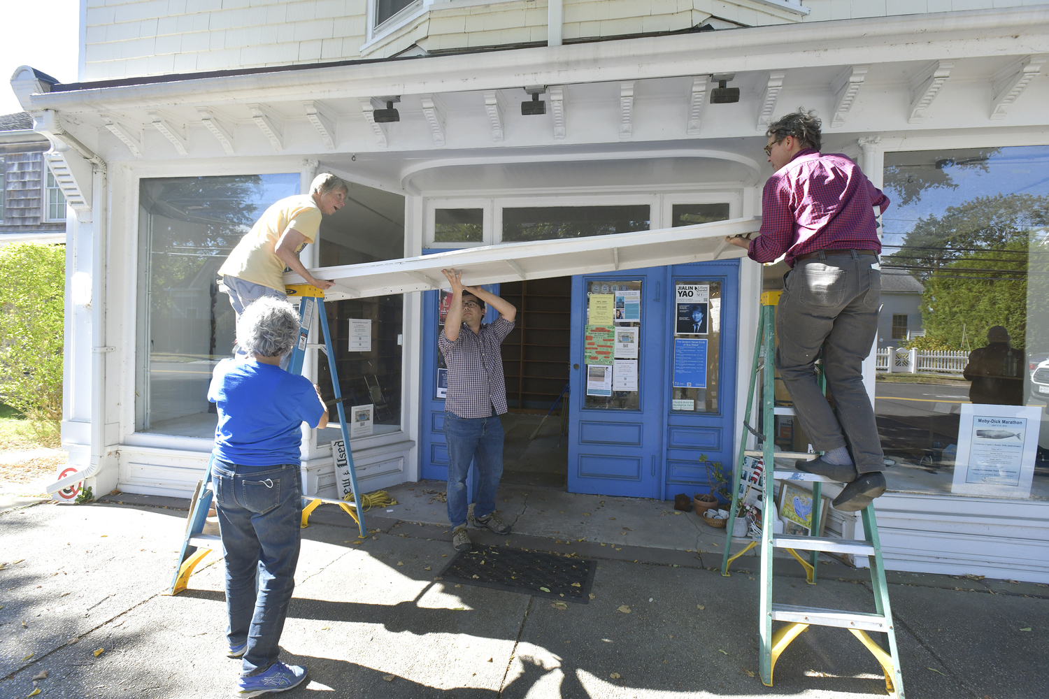 The Canio's Books sign on the front of the Sag Harbor mainstay came down on Monday afternoon marking and end of an era for the storefront and the community.   DANA SHAW