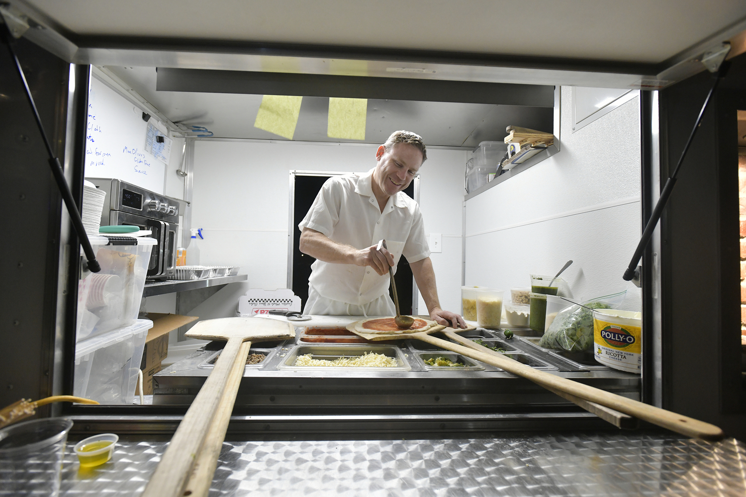 John Pirozzi makes a pizza at the North Sea Tavern's 