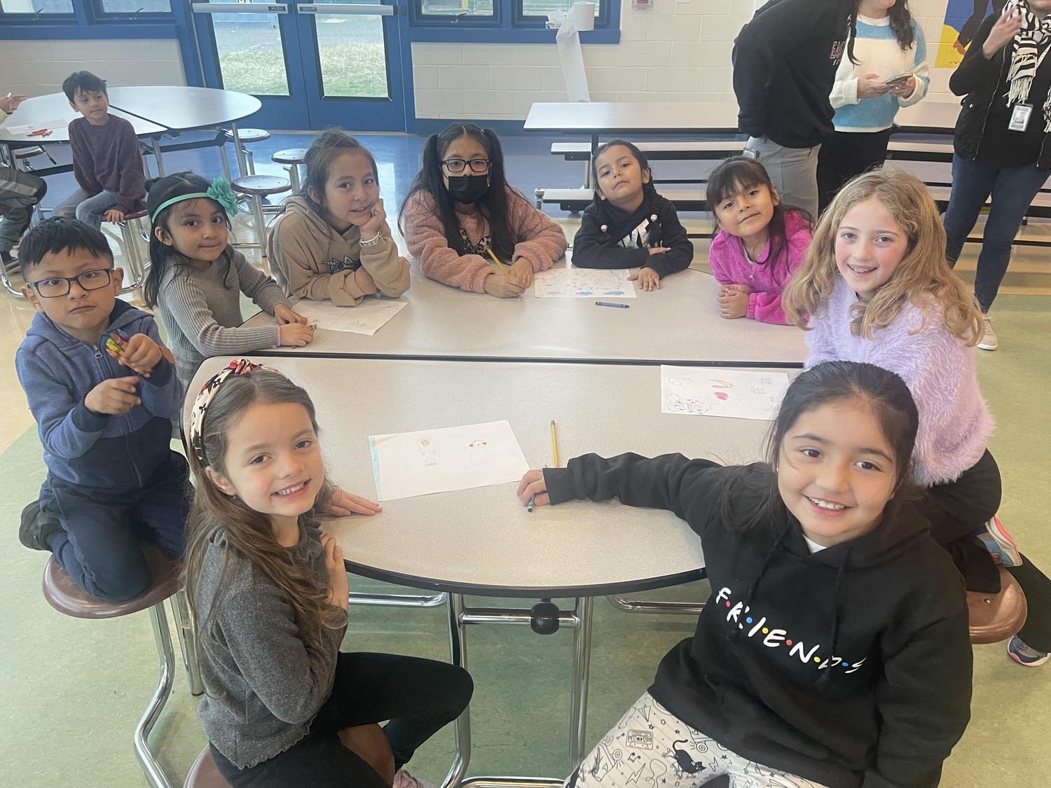 Isla Rubenstein, clockwise from bottom left, Jheycong Quijosaca, Aylie Llivicura, Juliett Pesantez-Soliz, Evelyn Bermeo-Villa, Sara Benalcazar, Valery Quizhpi, Brielle Ball and Danna Castillo, students at John M. Marshall Elementary School, work together in the East Hampton district's dual language program. COURTESY KAREN KUNETH