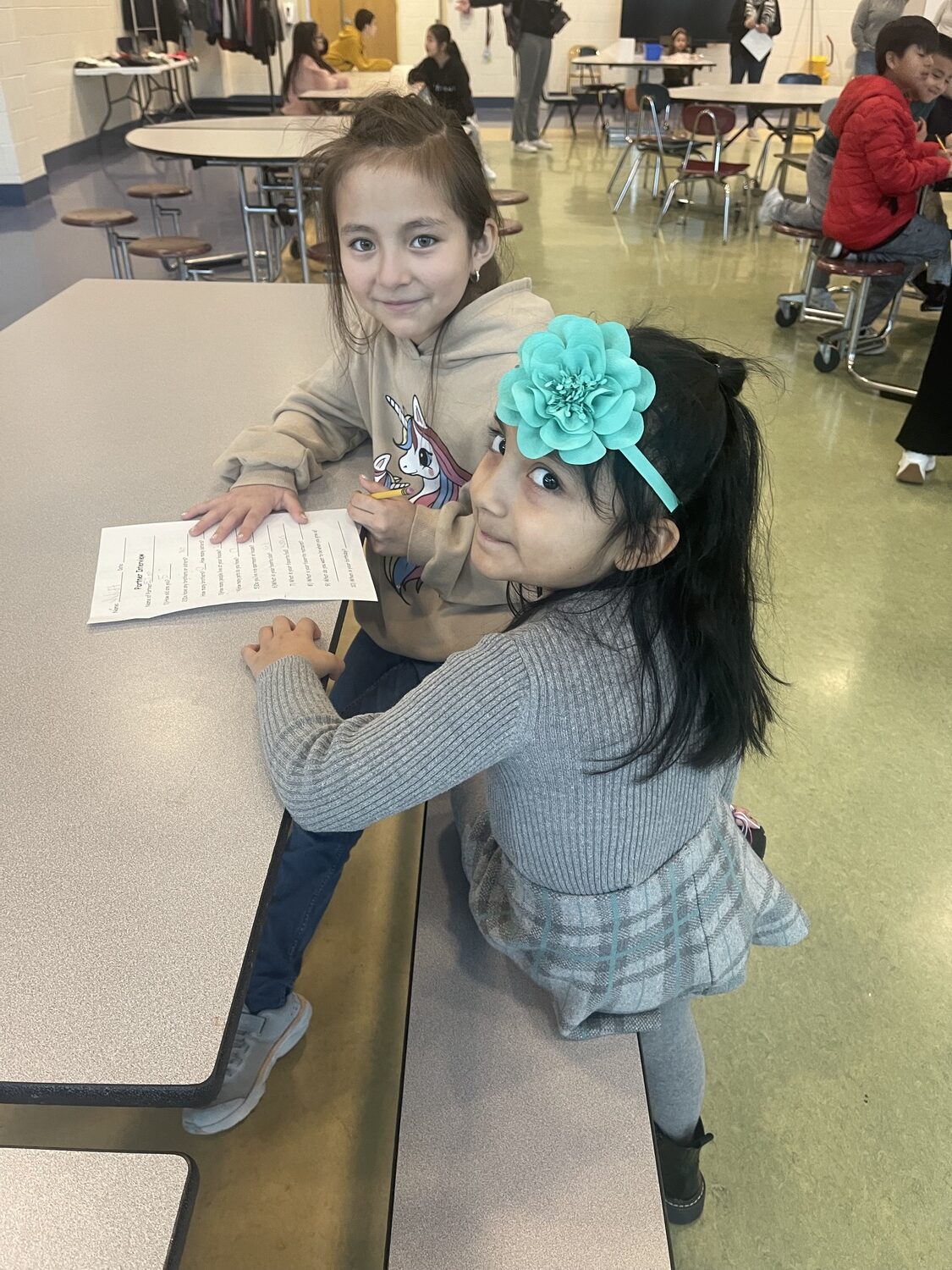 Aylie Livicura and Juliett Pesantez-Soli, students at John M. Marshall Elementary School, work together in the East Hampton district's dual language program. COURTESY KAREN KUNETH