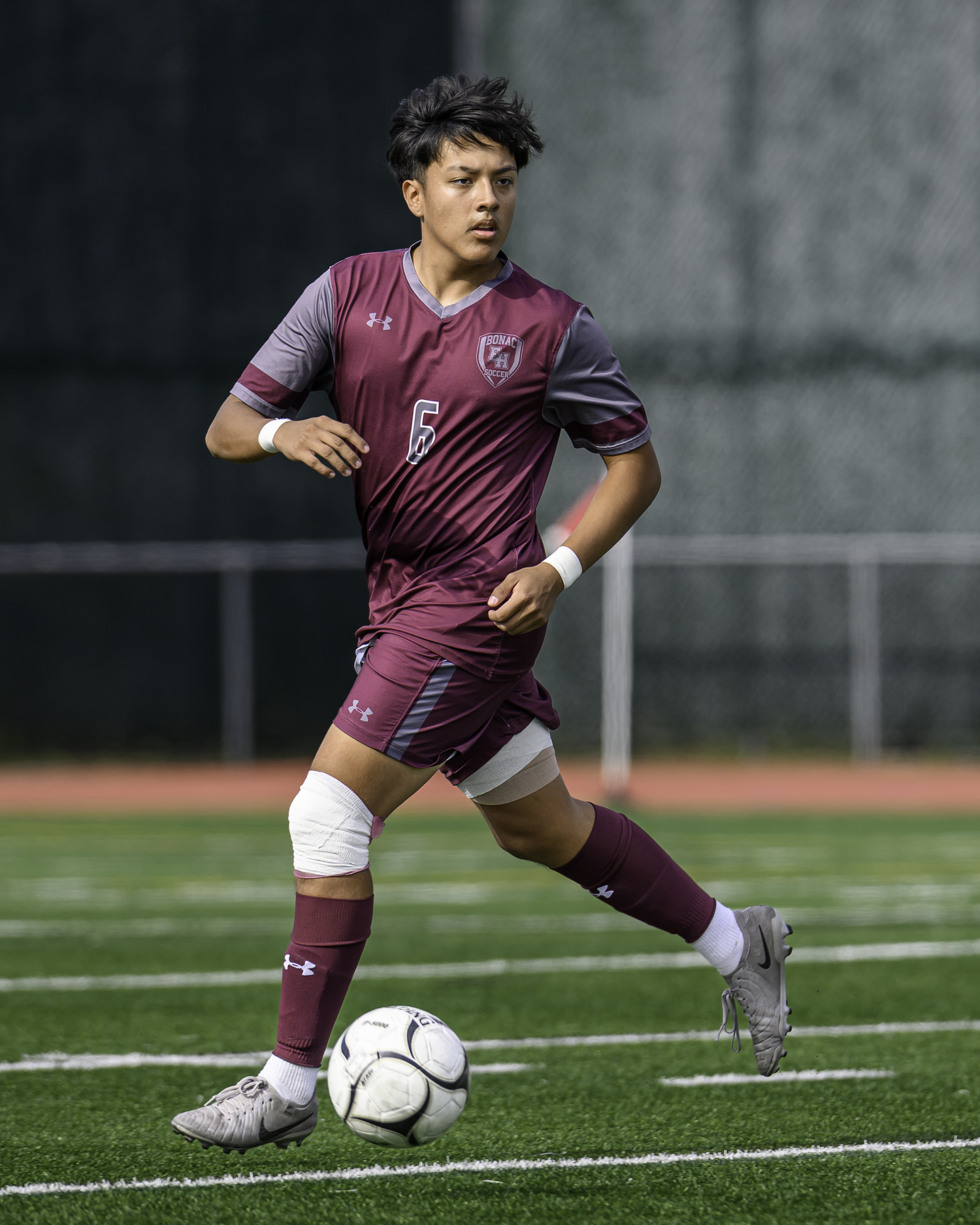 Senior midfielder Johnny Gonzalez dribbles the ball as he looks for a play. MARIANNE BARNETT