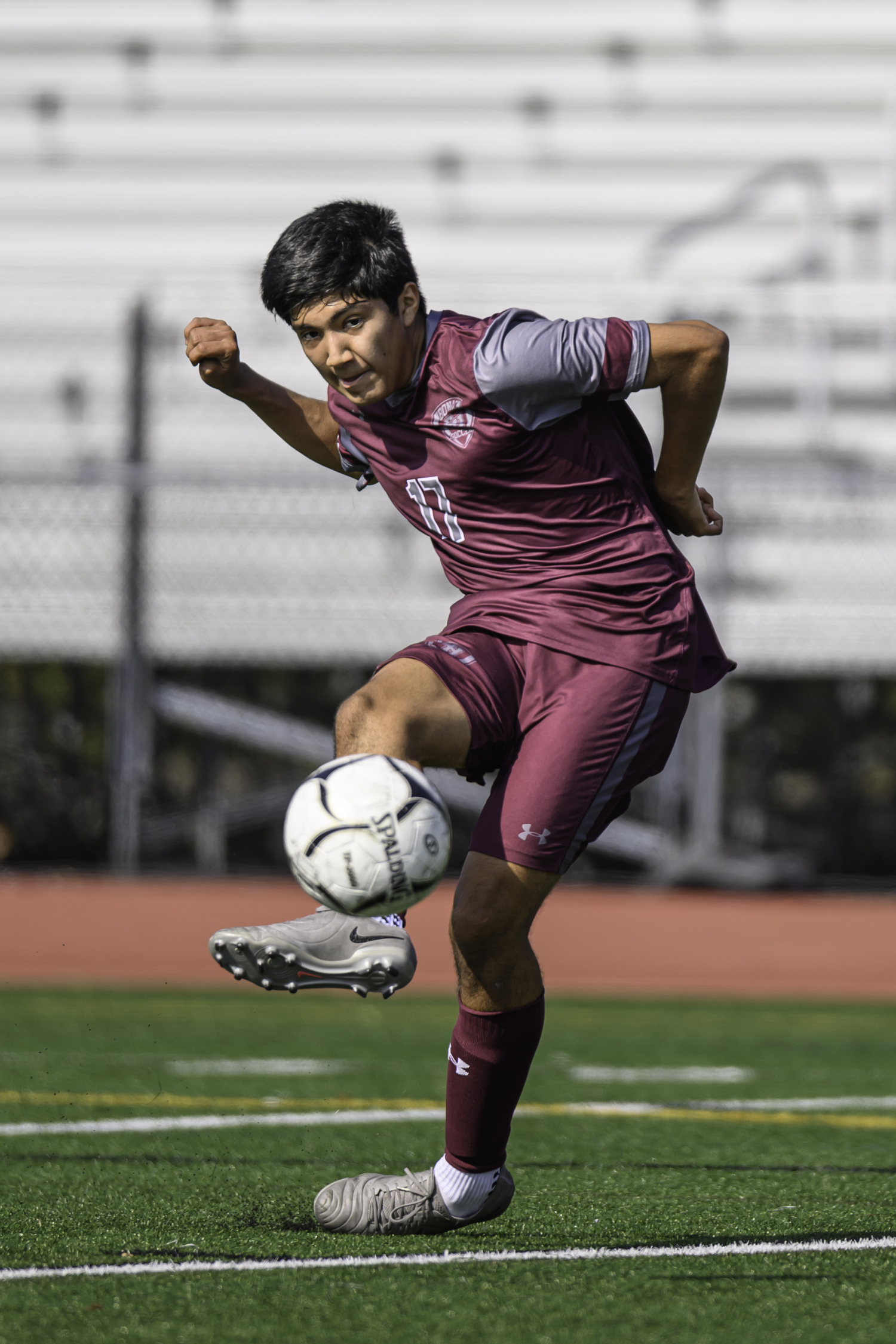 Junior midfielder Sean Perez sends the ball toward the goal. MARIANNE BARNETT