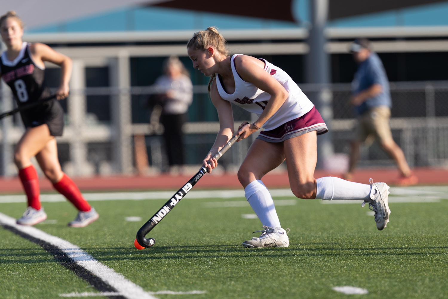 East Hampton senior Ava Tintle works the ball upfield.   RON ESPOSITO