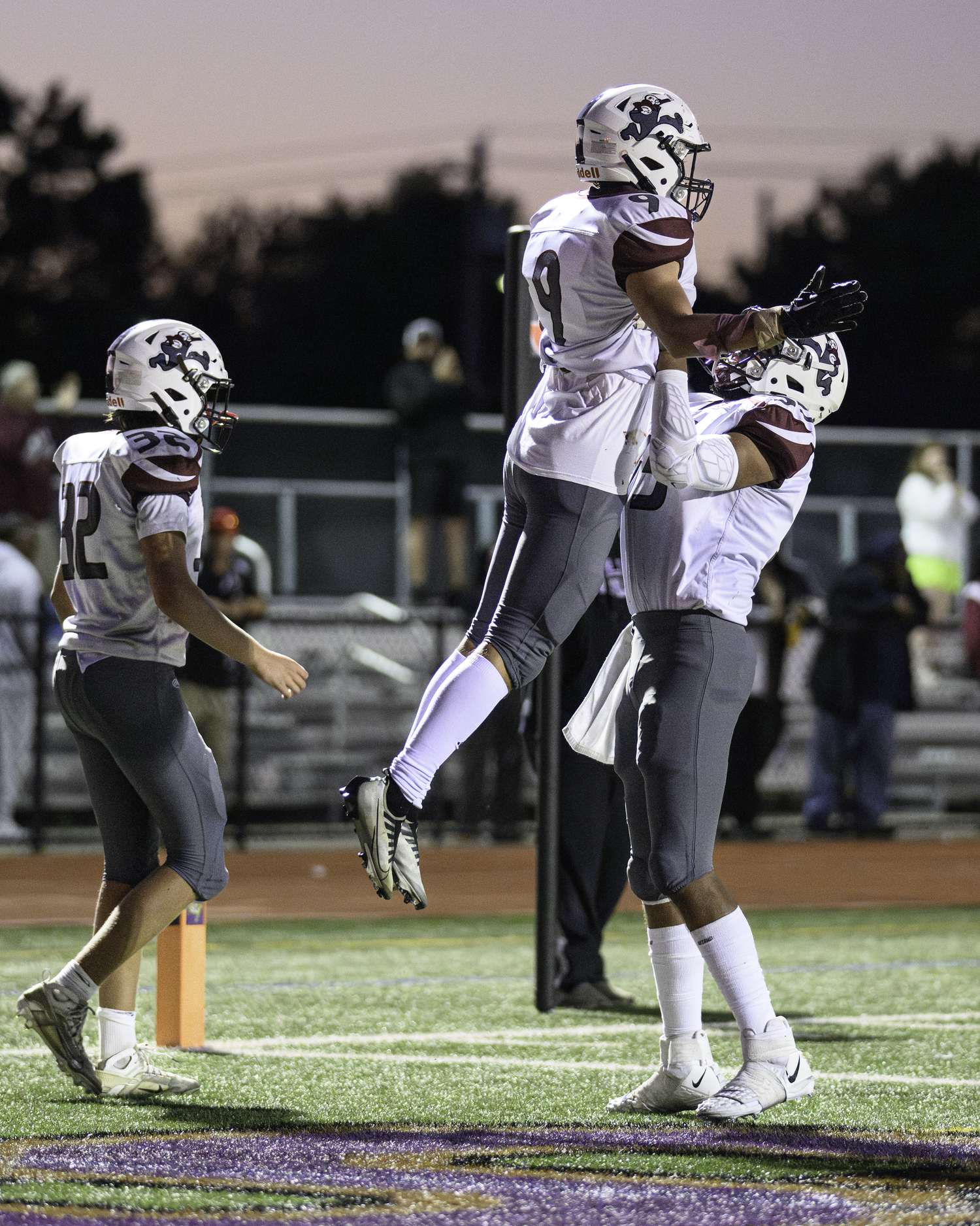 Charlie Stern is held up by a teammate after his touchdown.   MARIANNE BARNETT