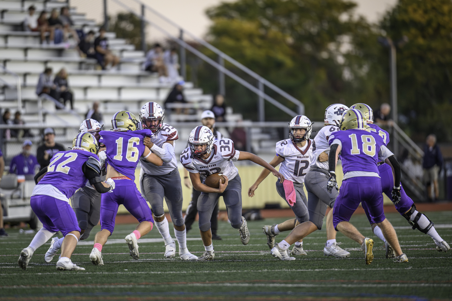 East Hampton junior James Corwin takes a handoff from junior quarterback Theo Ball and runs right up the middle for positive yards.   MARIANNE BARNETT