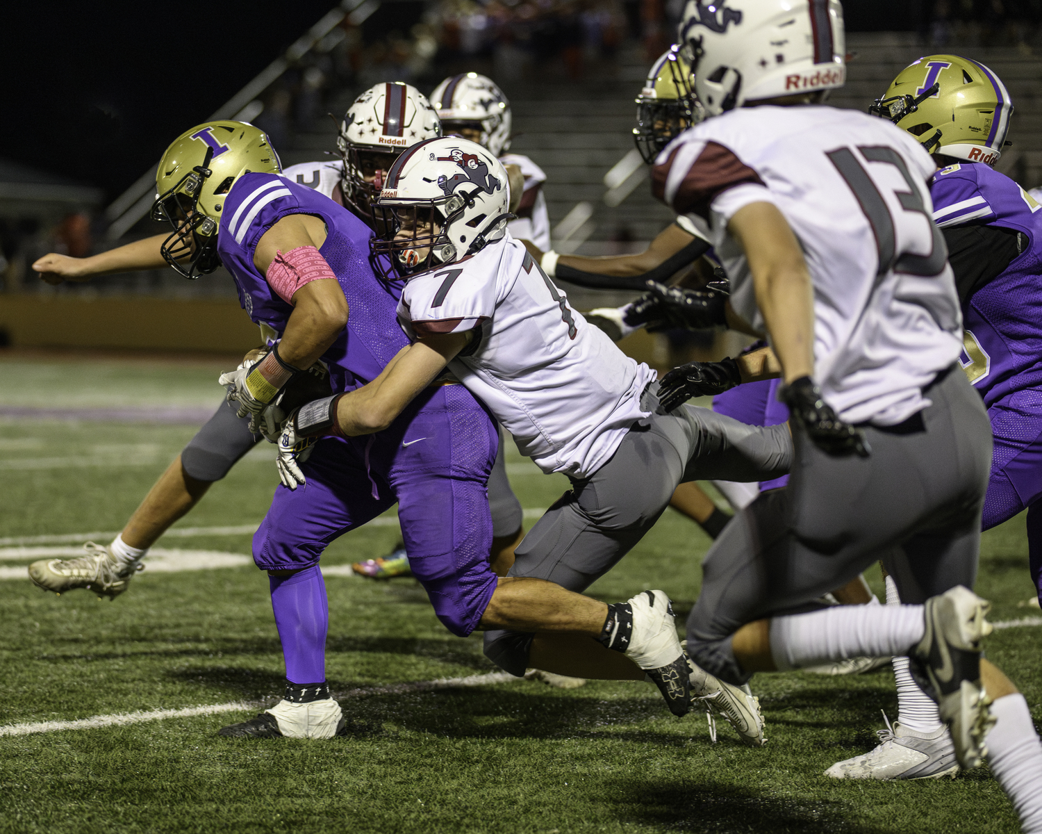 East Hampton junior Livs Kuplins wraps up an Islip player for a tackle.   MARIANNE BARNETT