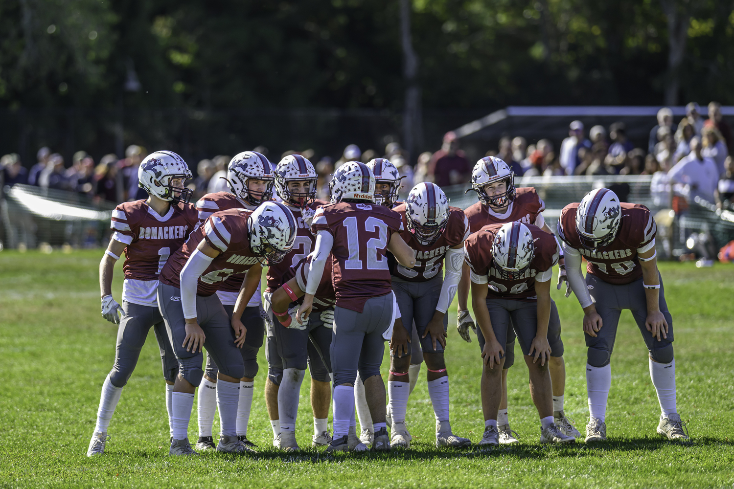 Junior quarterback Theo Ball (12) relays a play to his Bonac teammates.  MARIANNE BARNETT