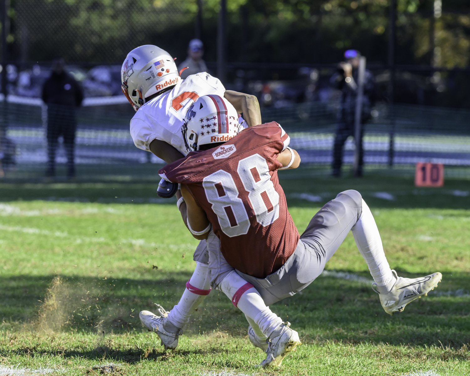 East Hampton senior Bowie Pipino sacks Amityville's quarterback.   MARIANNE BARNETT