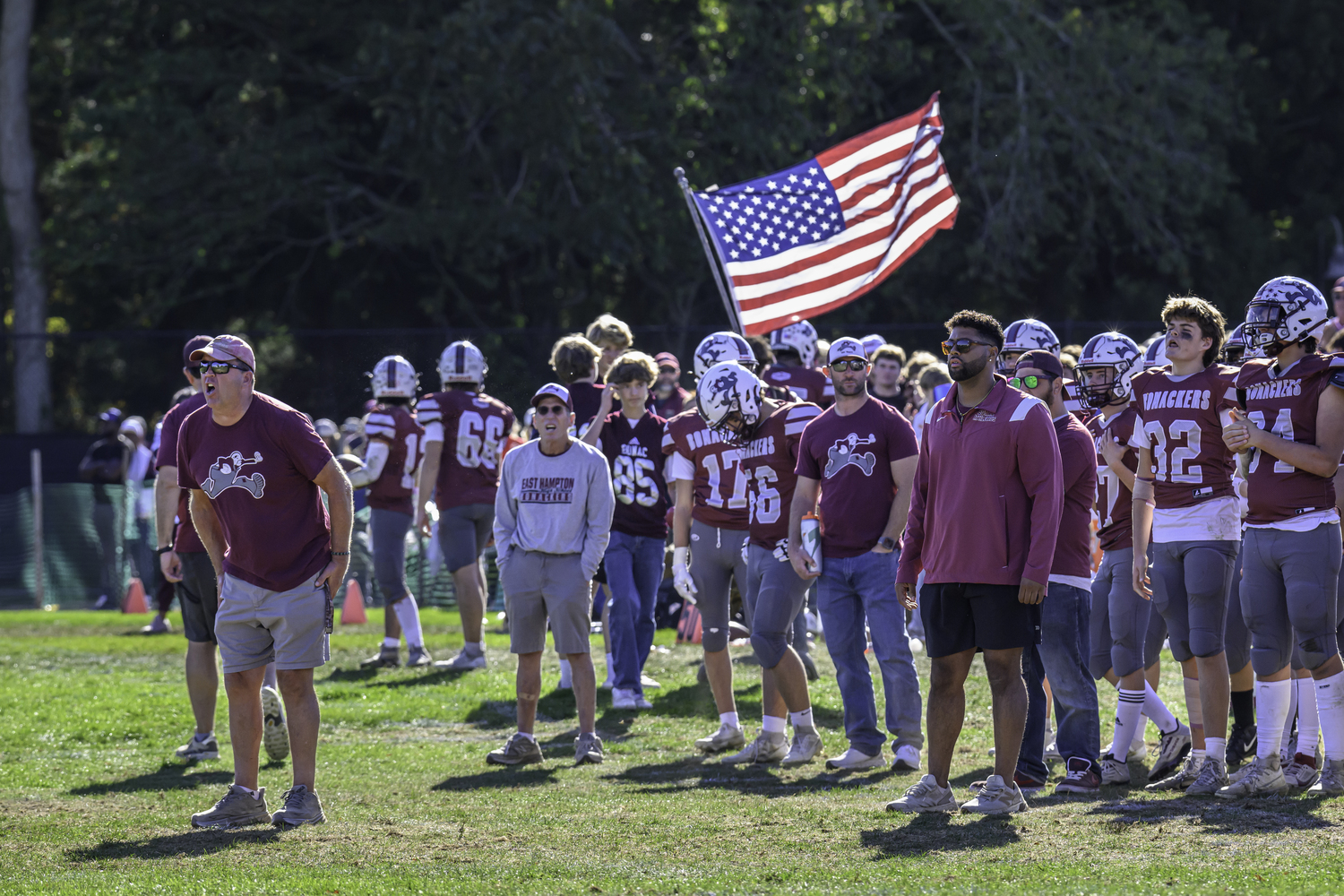 East Hampton head coach Joe McKee yells out to his team from the sideline.  MARIANNE BARNETT