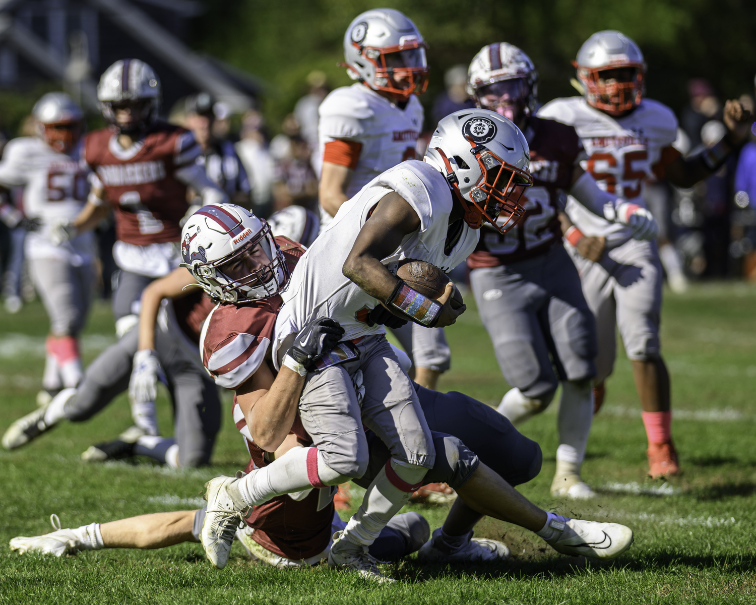 East Hampton sophomore Jackson Ronick tackles an Amityville player.   MARIANNE BARNETT