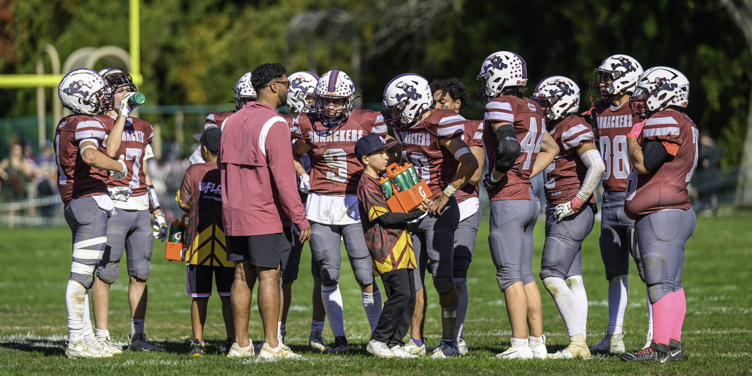 Jaron Greenidge talks to his players during a timeout.   MARIANNE BARNETT