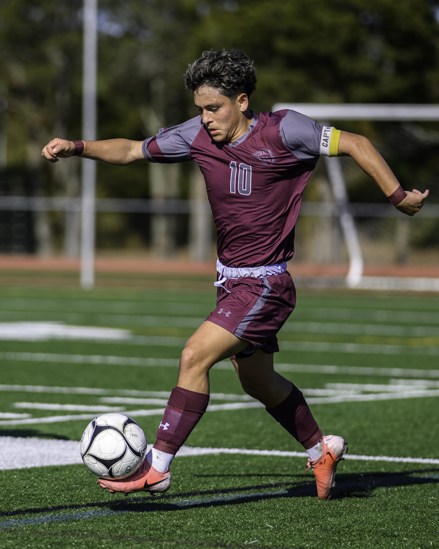 East Hampton junior co-captain Eduardo Calle moves the ball.   MARIANNE BARNETT