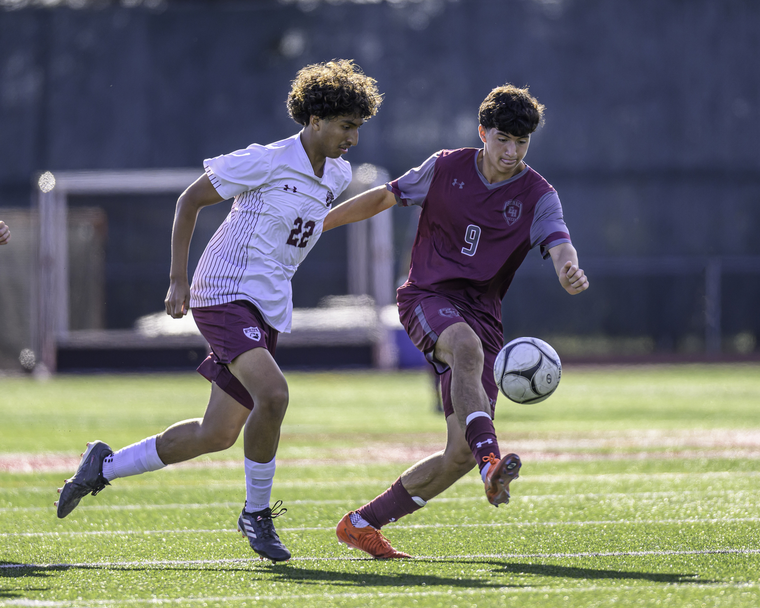 Deer Park junior Dave Osorio tracks the ball as Bonac senior Nolan Serrano plays it to his foot.  MARIANNE BARNETT