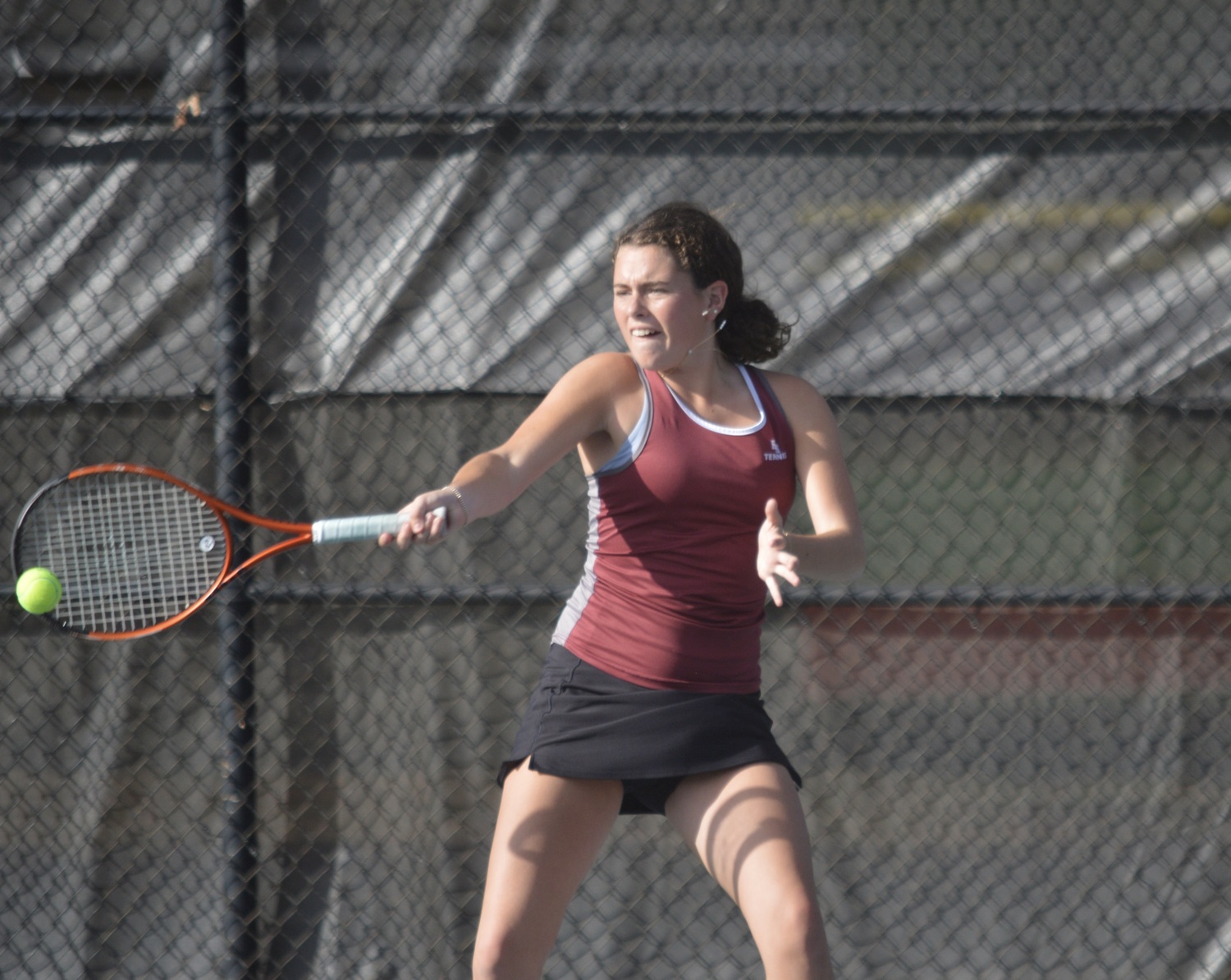 Ella Menu winds up a forehand against Commack.  GAVIN MENU