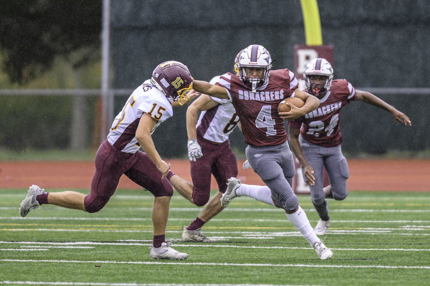 Bridgehampton junior Alex Davis stiff arms a Kings Park. He ran for over 200 yards and scored a total of four touchdowns.    MARIANNE BARNETT