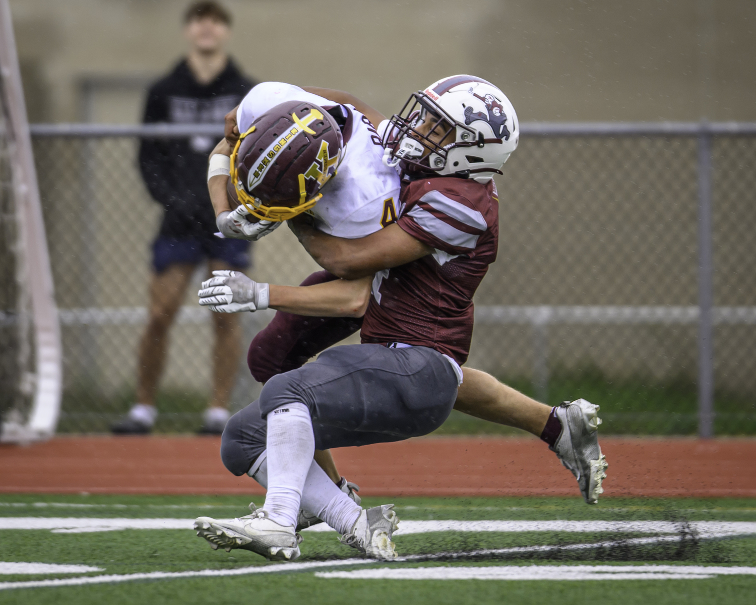 Alex Davis caught up to this Kings Park player to avoid a long touchdown run.   MARIANNE BARNETT