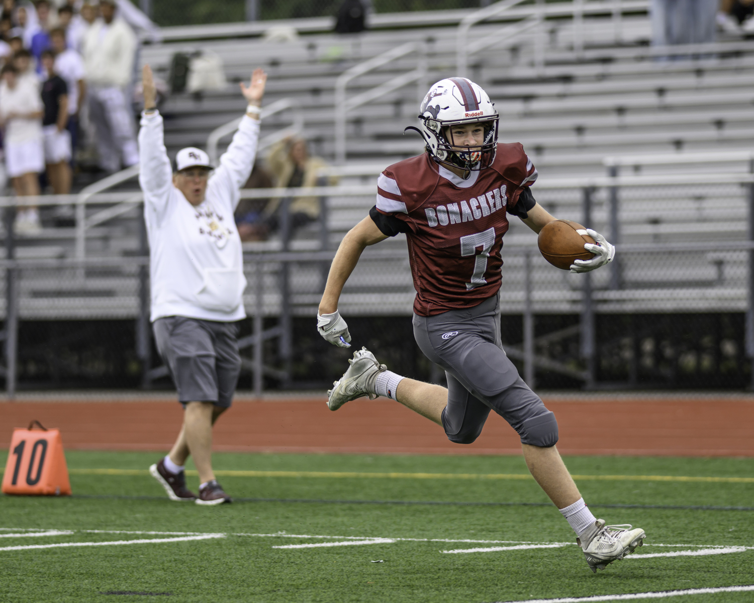 Livs Kuplins trots into the end zone for the Bonackers second touchdown of the first quarter, to the enjoyment of athletic director Kathy Masterson.   MARIANNE BARNETT