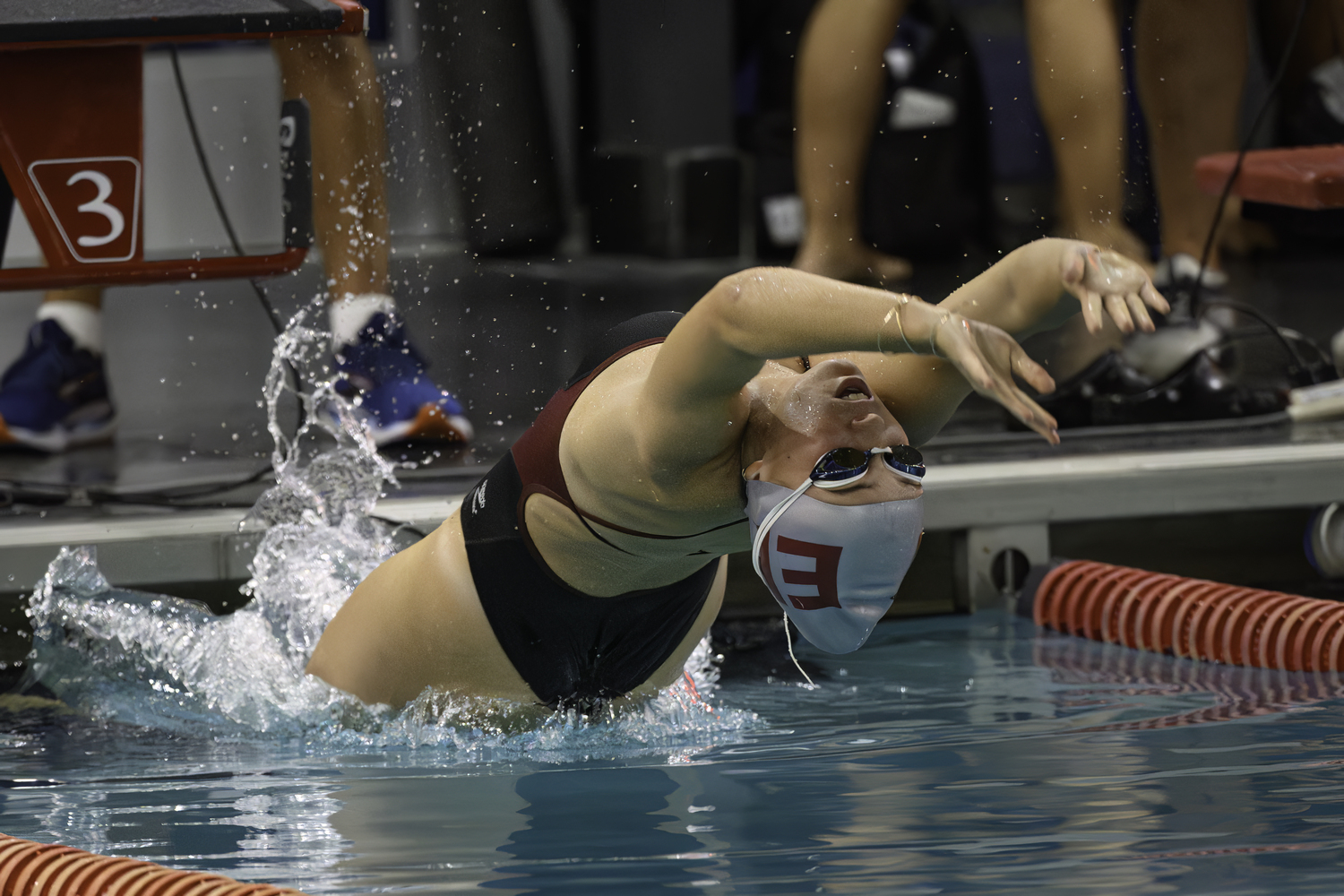 East Hampton senior Lily Griffin starts the 100-yard backstroke. MARIANNE BARNETT