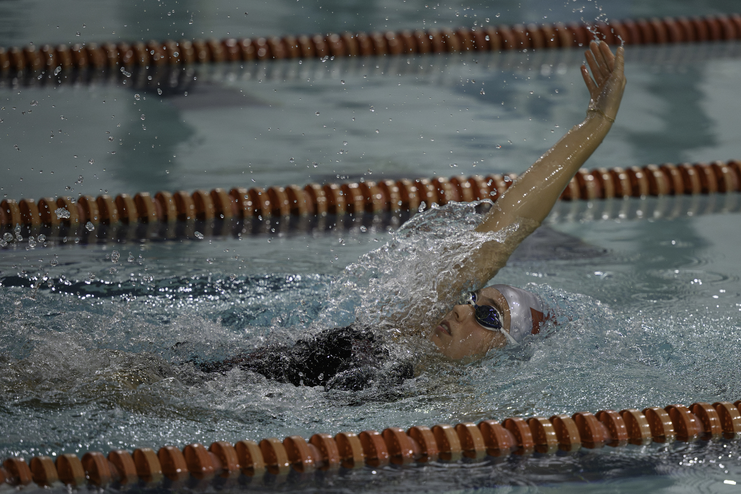 East Hampton senior Lily Griffin competing in the 100-yard backstroke. MARIANNE BARNETT