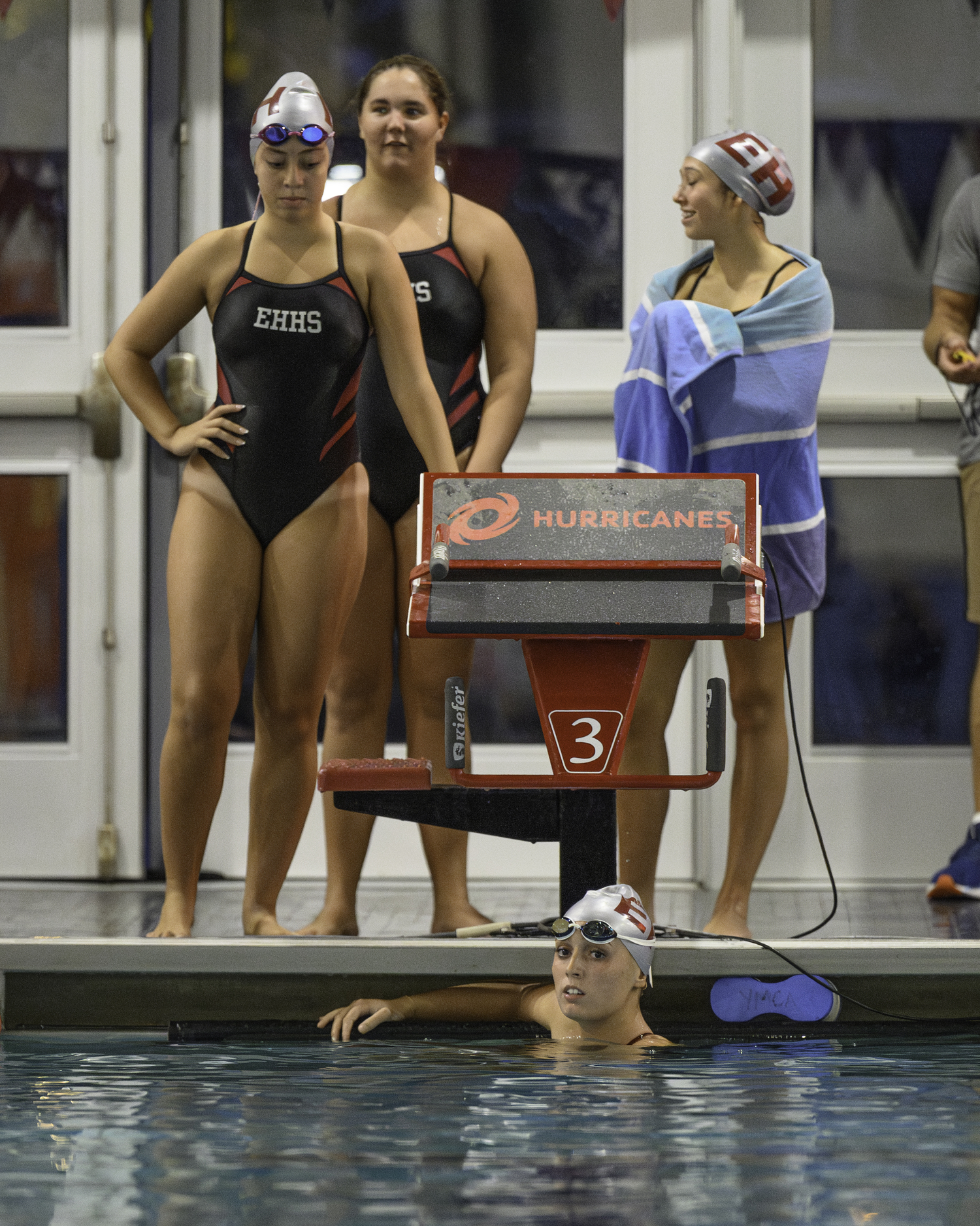 Bonac's winning freestyle relay team watches the rest of the race.   MARIANNE BARNETT