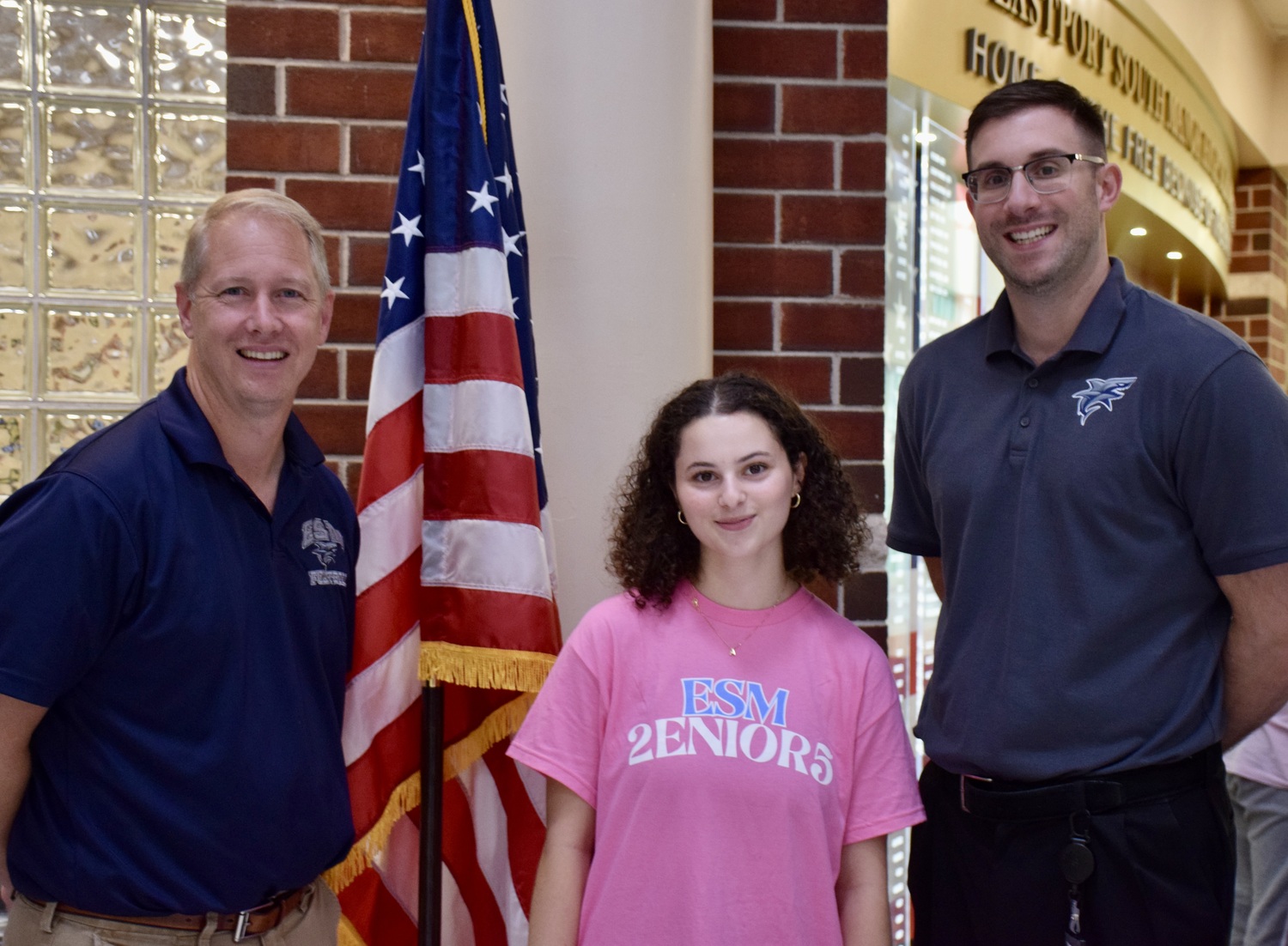 Eastport-South Manor Jr.-Sr. High School's Amanda Seligman was named a National Merit Scholarship Program Commended Student. She is congratulated by Principal Salvatore Alaimo and Assistant Principal Daniel Franchese. COURTESY EASTPORT-SOUTH MANOR SCHOOL DISTRICT