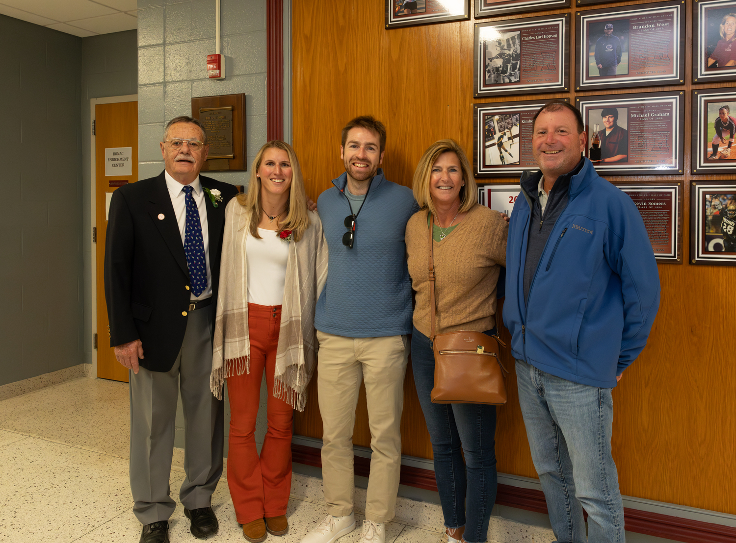 Ashley West Harney with coach Bill Herzog, far left, her husband Kevin Harvey and her parents.   RON ESPOSITO