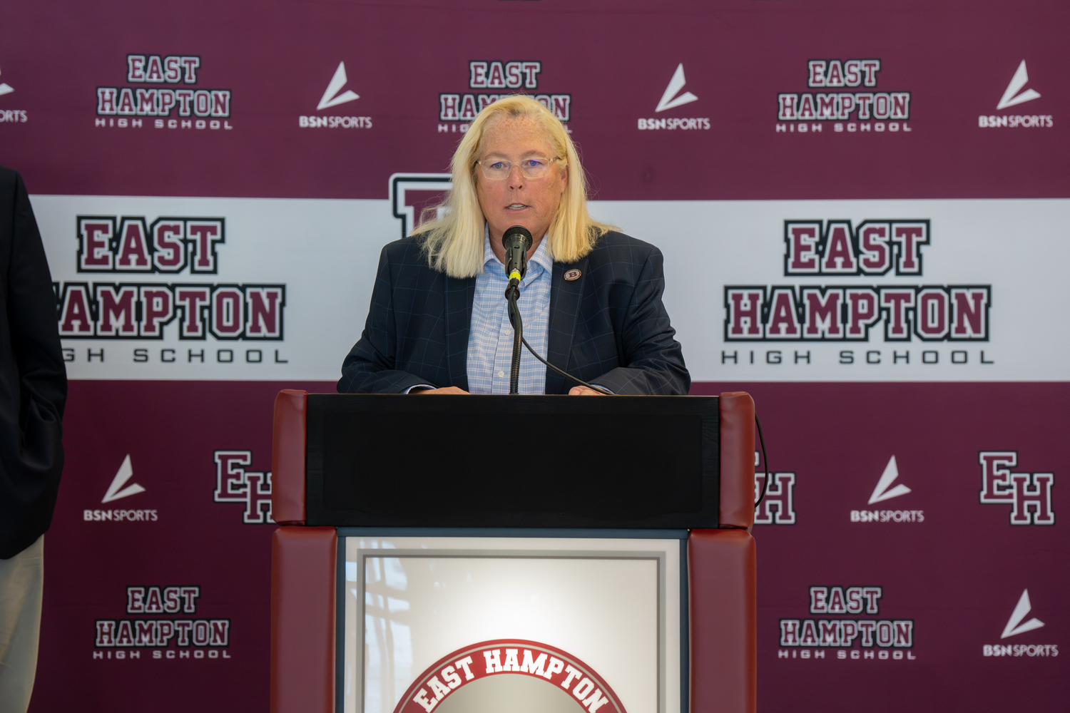 East Hampton Athletic Director Kathy Masterson gets the 2024 East Hampton Athletic Hall of Fame induction underway on Saturday morning.  RON ESPOSITO