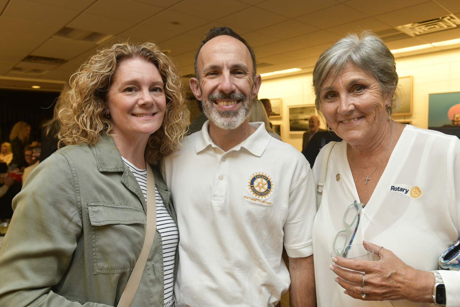 Kristin and James Grossi with Rosane Cassella at the Southampton Rotary Club's kick-off cocktail party for SouthamptonFest on Friday night at the Southampton Cultural Center.  DANA SHAW