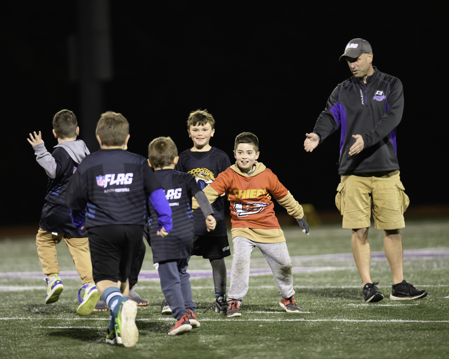 At halftime of Friday night's game, the Hampton Bays Flag Football League was honored.   MARIANNE BARNETT