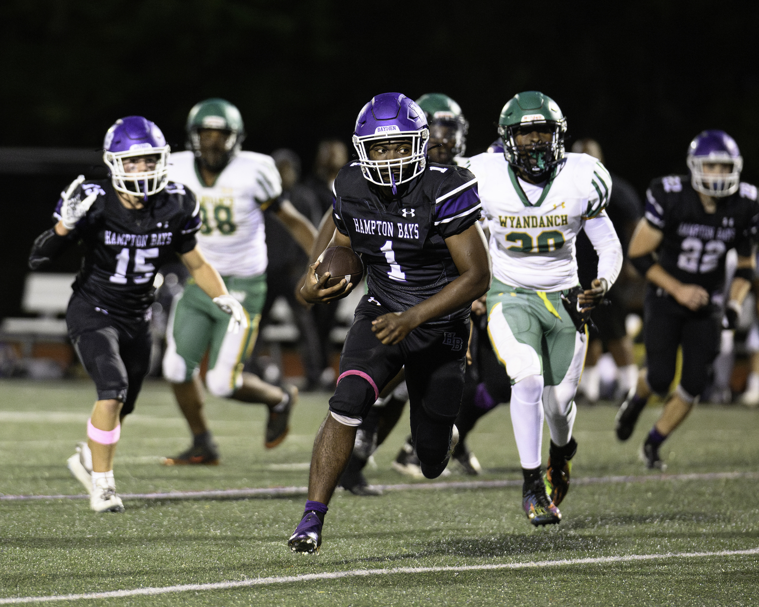 Hampton Bays senior C.J. Seymore gets loose for a positive gain.  MARIANNE BARNETT