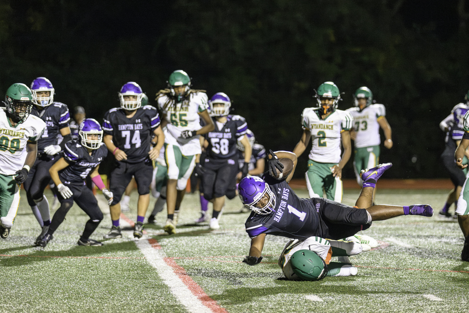 Hampton Bays senior C.J. Seymore tries to stretch out for a touchdown.   MARIANNE BARNETT