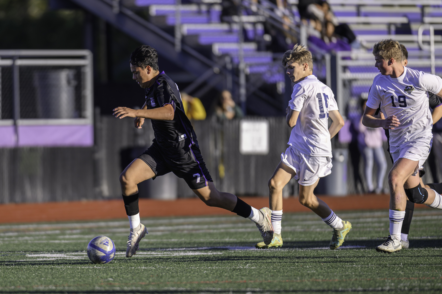 Hampton Bays senior Edie Cabrera gets behind a pair of Bayport defenders. MARIANNE BARNETT