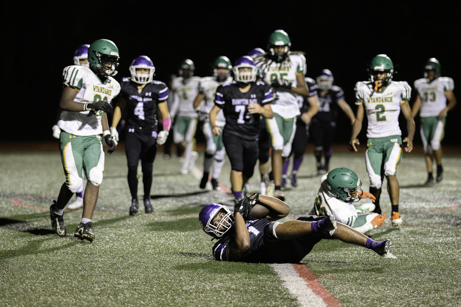 Hampton Bays senior C.J. Seymore scores the first touchdown of many for the Baymen on Friday night.   MARIANNE BARNETT