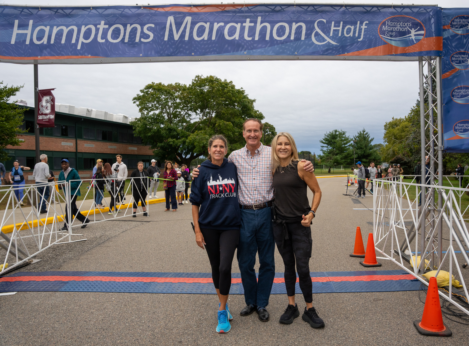 Hamptons Marathon race directors Amanda Moszkowski, left, and Diane Weinberger with Southampton Village Mayor Bill Manger.   RON ESPOSITO