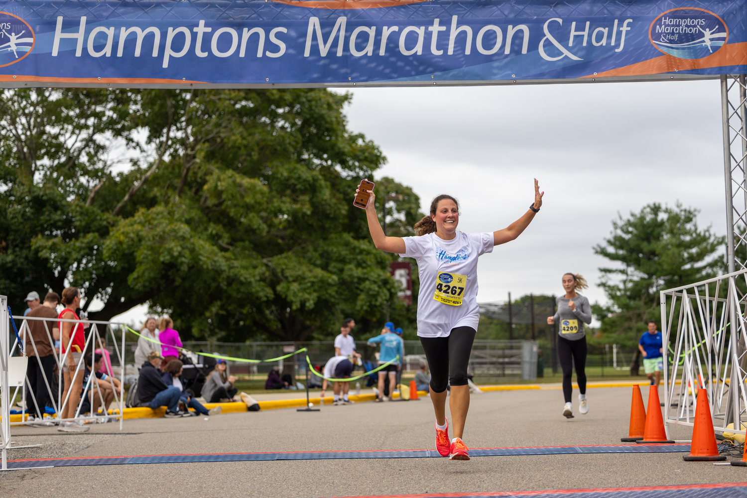 Florine Smolenski crosses the finish line in the 5K.  RON ESPOSITO