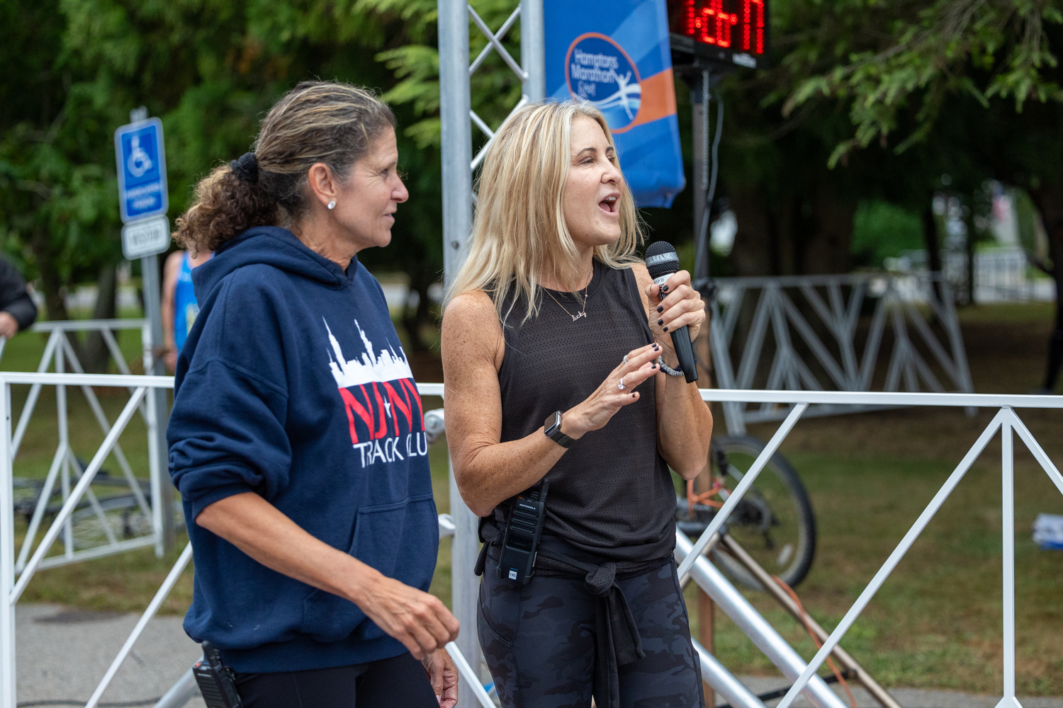 Amanda Moszkowski, left, and Diane Weinberger speak before Saturday morning's races.   RON ESPOSITO