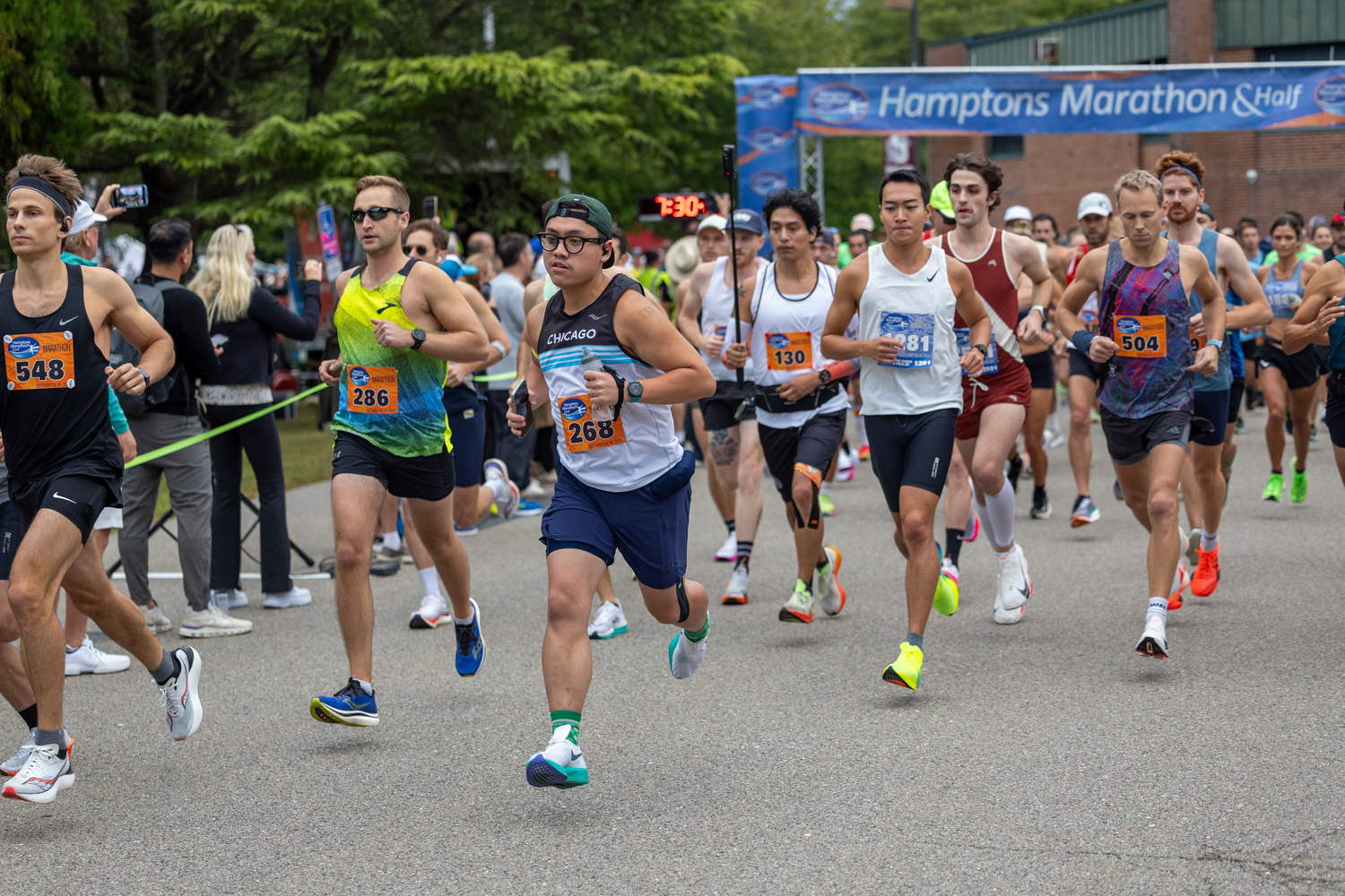 Runners get the Hamptons Marathon started on Saturday morning at Southampton Intermediate School.   RON ESPOSITO